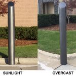 Comparing the Metallic Black Skyline Decorative Bollard Cover in the sunlight and in overcast.