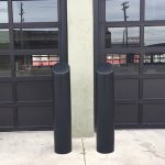 Black 6-inch Skyline Decorative Bollard Covers used for garage door protection