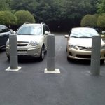 Light gray plastic Ribbed Decorative Bollard Covers used for parking lot protection