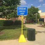 Yellow plastic Pyramid Sign Base used for Student drop-off signage